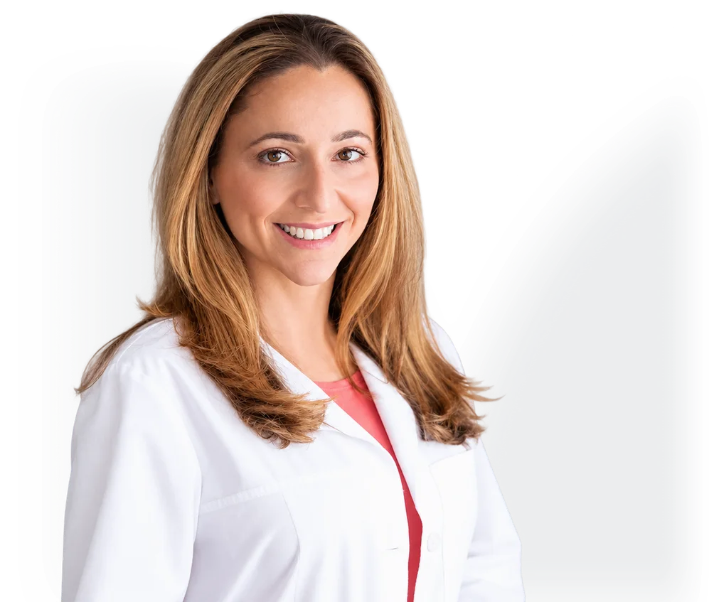 Dr. Natalya Urovish in a white coat, smiling